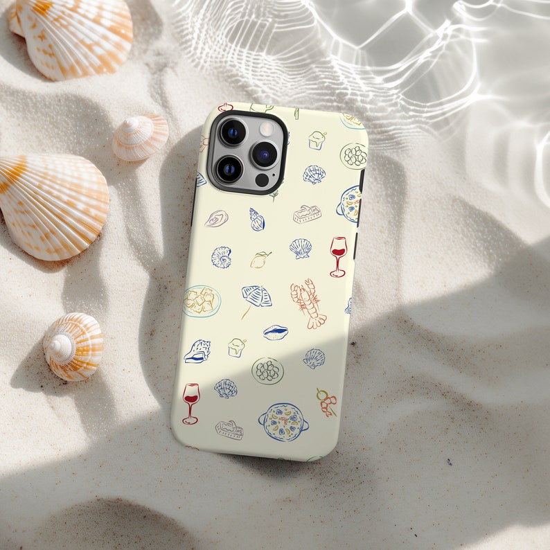 May include: A white phone case with a colorful pattern of seafood, wine glasses, and other food items. The case has a camera cutout and a white background.