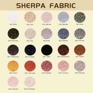 May include: A color chart titled SHERPA FABRIC displaying twenty-two circular swatches of textured sherpa fabric in various colors, including white, sand, baby pink, baby blue, green, forest green, ivory, steel, slate blue, iron gray, shadow gray, old navy, black, walnut brown, bronze, honey, red orange, mulberry, lava gray, rose pink, and champagne.