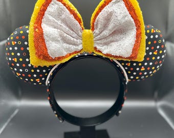 Candy Corn inspired mouse ears. Large Halloween bow on Mickey ears.