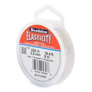 May include: A spool of clear Beadalon Elasticity elastic cord, 0.5 mm in diameter, 5 metres long. The spool is white with red and black text.