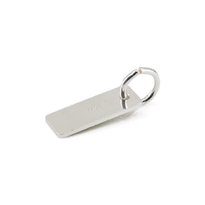May include: Silver rectangular tag with a jump ring. The tag has the word "925" engraved on it.