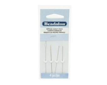 May include: A pack of four Beadalon needles for beading. The needles are silver and have white plastic tips. The packaging is white with blue text that reads "Beadalon Needles Variety Pack Varieté d'Aiguilles Paquete de Agujas Variado" and "4 pc/pz".