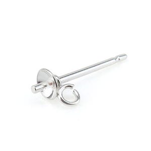 May include: A silver earring post with a flat, circular base and a small loop. The post is a straight, slender rod with a pointed end. The earring component is designed for jewellery making.