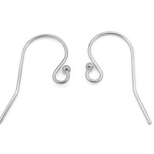 May include: A pair of silver-toned earring hooks with a small ball at the top of the hook.