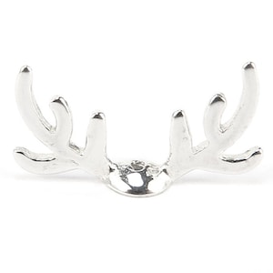 May include: Silver-toned metal deer antler ring holder. The holder is shaped like a deer's antlers with a round base.