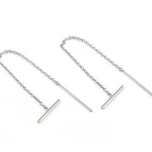 May include: A pair of silver chain earrings with a straight bar at the end of each chain.