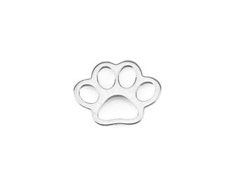 May include: A silver-coloured paw print charm, a symbol of pet love, is displayed against a white background. The charm's design features five rounded pads, creating a simple yet recognisable shape. Ideal for pet-themed jewellery or crafts.