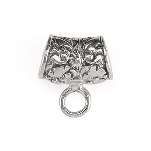 May include: Silver-toned metal bead with an ornate design and a small loop at the bottom.