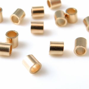 14K goud krimp 2 mm x 2 mm ~ 1 stuk