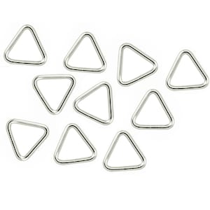 May include: Ten silver triangle-shaped metal rings. The rings are approximately 2.5 cm in diameter.