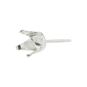 May include: Silver earring setting with a prong setting for a round stone.