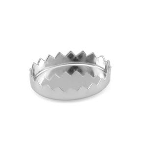 May include: A small, oval-shaped silver dish with a zig-zag edge. The dish is made of a shiny metal and sits on a white background. The dish is likely used for serving small portions of food or as a decorative item.