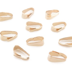 May include: Ten gold-toned metal pendant bails, designed to hold a pendant or charm. The bails are shaped like a teardrop with a small opening at the top.