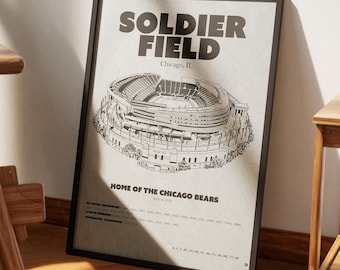 May include: Black framed print featuring a detailed illustration of Soldier Field in Chicago, IL. The print includes the text "SOLDIER FIELD" and "HOME OF THE CHICAGO BEARS". The print also lists the team's championship years.