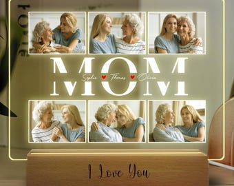 May include: A personalized LED photo display with the word "MOM" in large white letters. The display features six family photos and the text "I Love You" on the wooden base. The photos are of a mother and daughter.