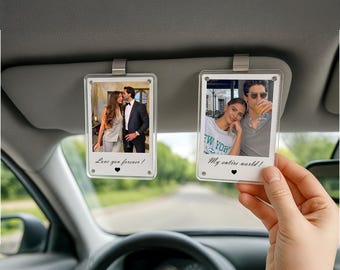 May include: Clear acrylic photo car visor clips, each displaying a couple's photo. One clip has the text "Love you forever!" and the other reads "My entire world!" Both clips are attached to a car visor.