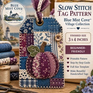 May include: A rectangular fabric tag featuring a patchwork design of blue and purple floral and patterned textiles. A central fabric pumpkin appliqué is stitched onto the surface. The tag includes a metal eyelet, a fabric ribbon, and a wooden button.