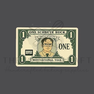 May include: A novelty one-dollar bill featuring Dwight Schrute from The Office. The bill reads "One Schrute Buck" with Dwight's portrait, the Dunder Mifflin logo, and the words "Motivational Tool."