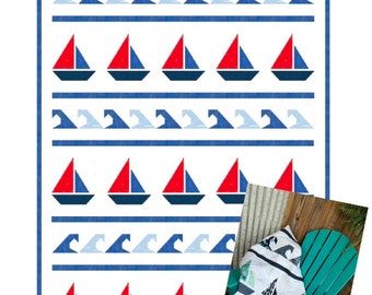 May include: A quilting pattern for a nautical themed quilt featuring red and blue sailboats and blue waves on a white background. The pattern is called "Chatham Races" by Sally Lawrence Designs and measures 74 inches by 102 inches.