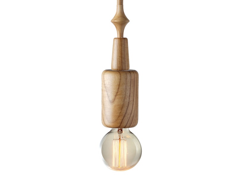 Light wood pendant light with minimalist sculptural form and Edison bulb, bringing a fresh, natural vibe to Scandinavian-style interiors