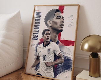 May include: A framed vertical poster featuring a graphic illustration of Jude Bellingham. The artwork displays a large portrait and a full-body image of the athlete in an England national team jersey with the number 10. Text includes BELLINGHAM.