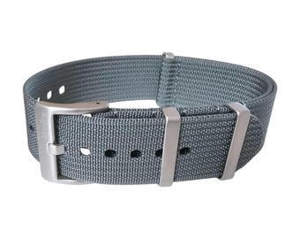 May include: A gray nylon watch strap with silver buckle and keepers. The strap has a textured woven design.