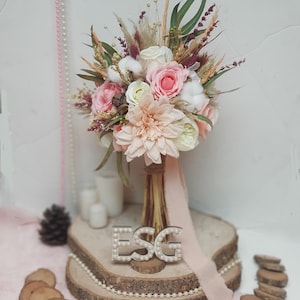 Bouquet design made with pink color, dried flowers, artificial handmade wedding accessories