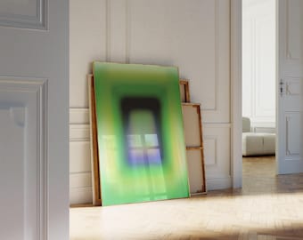 May include: A framed abstract painting with a green, blue, and purple gradient. The painting is hanging on a white wall in a room with wooden floors.