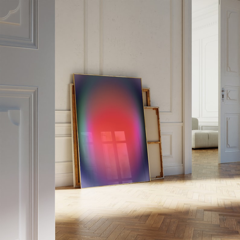 May include: A framed abstract art print with a gradient of colours, including purple, pink, and blue, in a modern interior setting.