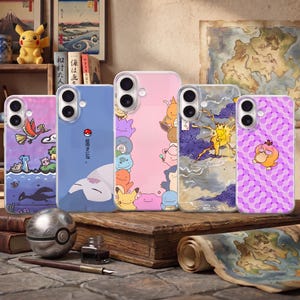 May include: Five smartphone cases featuring various character designs. One case shows a purple landscape with flying creatures, another a blue background with a sleeping character, a pink one with multiple characters, a stormy scene, and a purple checkered pattern.