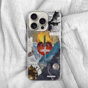 May include: A clear smartphone case featuring a collage design with a central red heart pierced by a silver sword surrounded by orange flames. The graphic includes a black dragon silhouette, a moon, a crown, and text reading Fireheart and Rilea.