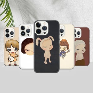 May include: Five phone cases with cartoon character designs. The cases are in various colours, including beige, white, black, and brown. The illustrations depict different characters with unique expressions and styles, in a cartoon style.