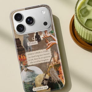 May include: A clear smartphone case featuring a collage of fantasy-themed imagery, including a white wolf, a castle, flames, and a person with long blonde hair holding a sword. The text reads: "ONCE UPON A TIME, in a land long since burned to ash, there lived a princess who loved her kingdom...", "Fireheart", and "To Whatever End".