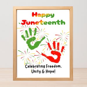 May include: A framed print with the words "Happy Juneteenth" in colorful letters. The image features green and red handprints, fireworks, and the text "Celebrating Freedom, Unity & Hope!"