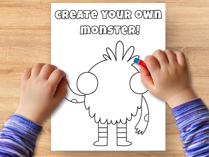May include: A coloring page with the text "CREATE YOUR OWN MONSTER!" features a cartoon monster outline. A child's hand holds a red crayon, coloring the monster's head. The image is on a white paper.