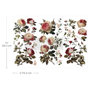 May include: A set of floral rub-on transfers featuring various rose blossoms and green leaves in shades of red, pink, and cream. The sheet measures 12 inches in height and 6 inches in width, displaying multiple botanical illustrations arranged across three vertical panels.