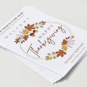 May include: A stack of white Thanksgiving service flyers. The design includes a circular wreath of fall leaves and the words "Happy Thanksgiving" in a script font. The text "Sunday Service November 20, 2024" is also visible.