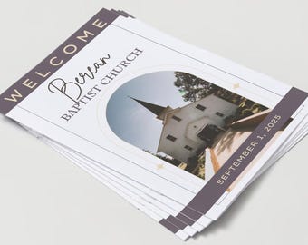 May include: A stack of printed materials featuring the text "WELCOME" and "Berean Baptist Church." The design includes an image of a church building within an arched frame. The date "SEPTEMBER 1, 2025" is also visible.
