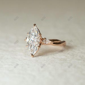 2 carat lab created marquise diamond ring with three-stone brilliance and a pinched shank design — a unique engagement or wedding ring for her. Ideal as a romantic anniversary gift or luxury diamond ring for girls who love ethical elegance and classic sparkle.