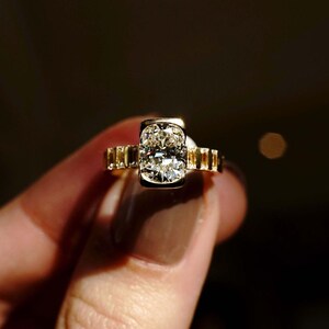 Modern 2ct cushion solitaire lab diamond ring in a half bezel mount with a softly tapered flair shank. Designed as a sustainable engagement or anniversary ring, this elegant piece also makes a perfect gift for her on birthdays or special milestones.