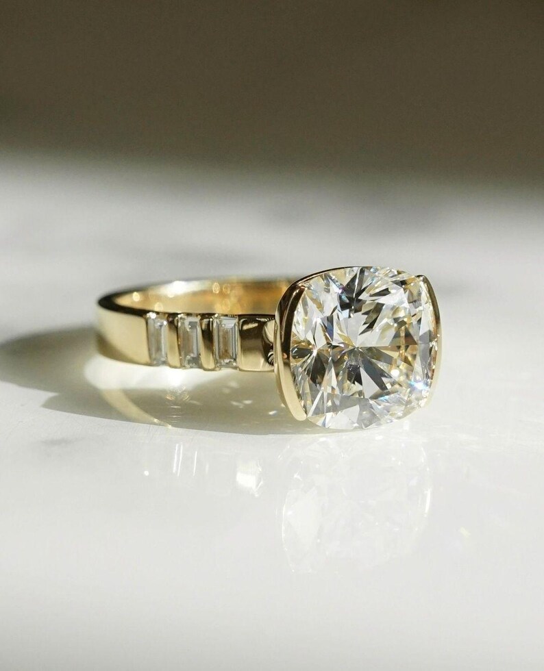 Cushion cut 4 carat lab created diamond ring with half bezel center and pavé band. A modern and elegant bridal or promise ring — ideal for everyday wear.
