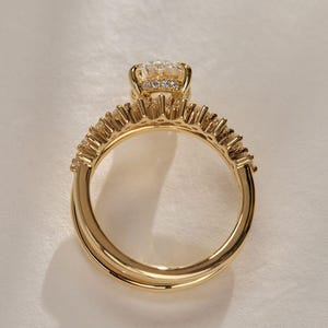 Stunning oval cut 2.20tcw lab created diamond ring featuring a hidden halo, pavé setting, and bold double band with dome shank. Ideal for proposals, anniversaries, or a special gift for your girlfriend—this ring radiates love and brilliance.