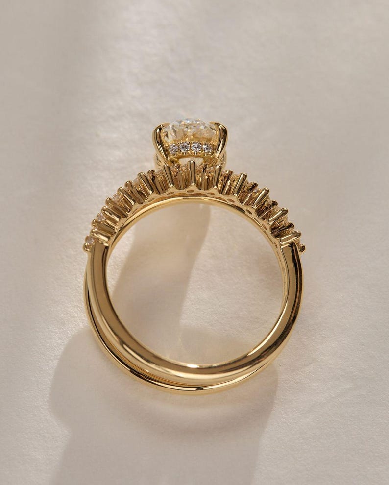 Stunning oval cut 2.20tcw lab created diamond ring featuring a hidden halo, pavé setting, and bold double band with dome shank. Ideal for proposals, anniversaries, or a special gift for your girlfriend—this ring radiates love and brilliance.