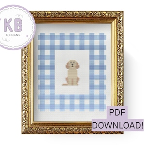 May include: Cross-stitch art of a tan puppy dog inside a blue and white gingham border, framed in a gold ornate frame. The image includes the text "PDF DOWNLOAD!" and the "KB DESIGNS" logo.