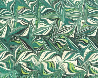May include: Abstract marbled paper with a swirling pattern of green, white, and black. The pattern resembles leaves or feathers.