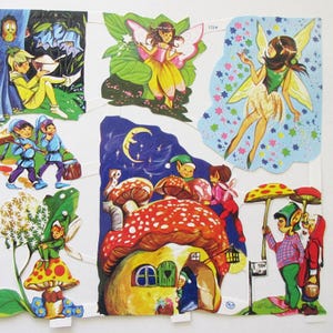 Puede incluir: Un conjunto de recortes de papel coloridos con hadas, duendes y setas. Las hadas tienen alas y llevan vestidos. Los duendes llevan ropa verde y azul. Las setas son rojas y blancas con manchas blancas. Los recortes son perfectos para crear una escena fantástica.