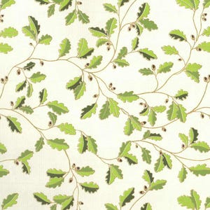 May include: A repeating pattern of green oak leaves and acorns on a cream background. The leaves have a detailed, textured appearance, and the stems are a light brown color. The design is reminiscent of a natural, botanical theme.