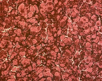 May include: A marbled paper pattern featuring a dense arrangement of interconnected circular and organic shapes in shades of deep burgundy, muted rose, and soft pink, separated by thin, intricate veins of off-white and cream.