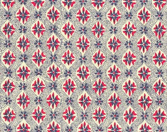 May include: A repeating pattern featuring diamond shapes with red and navy floral designs on a cream background. Small navy dots fill the spaces between the diamonds and flowers. This design is suitable for fabric, wallpaper, or other decorative applications.