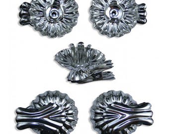 May include: Five silver metal candle holders with a scalloped design. The holders have a clip on the back to attach them to a wreath or other object.